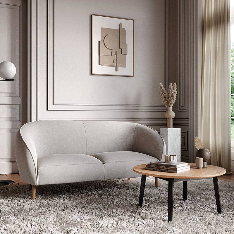 Rundt træ sofabord med sildebens mønster i fineret eg og sorte gummitræsben.